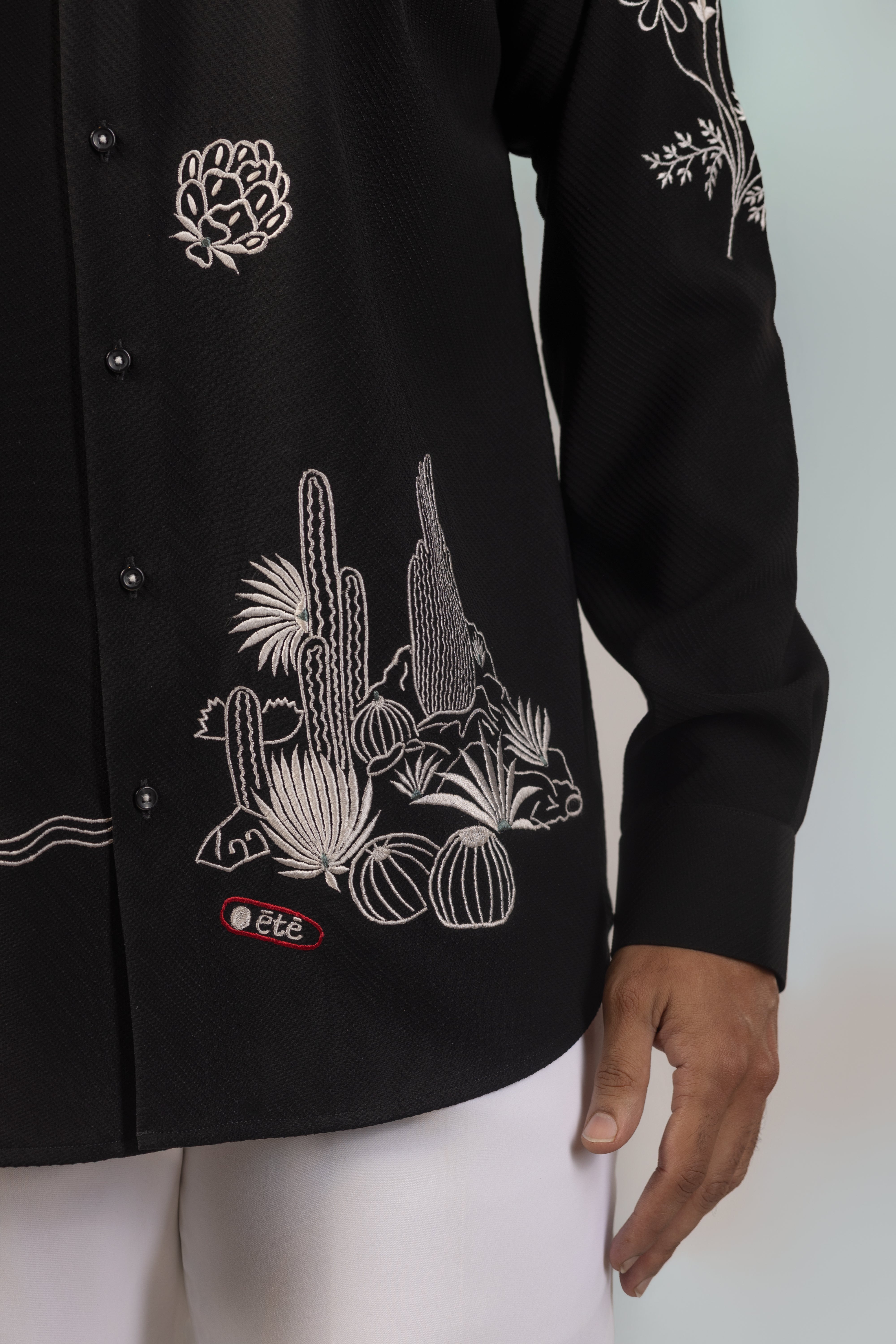 Black Shirt with Scattered White Embroidery and Red Script Detail